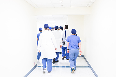 Doctors walking down a hallway together