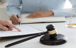 attorney at desk with client