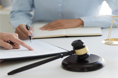 attorney at desk with client