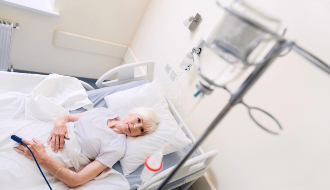 A woman in a hospital bed