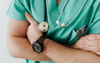 Doctor crossing his arms with stethoscope around neck
