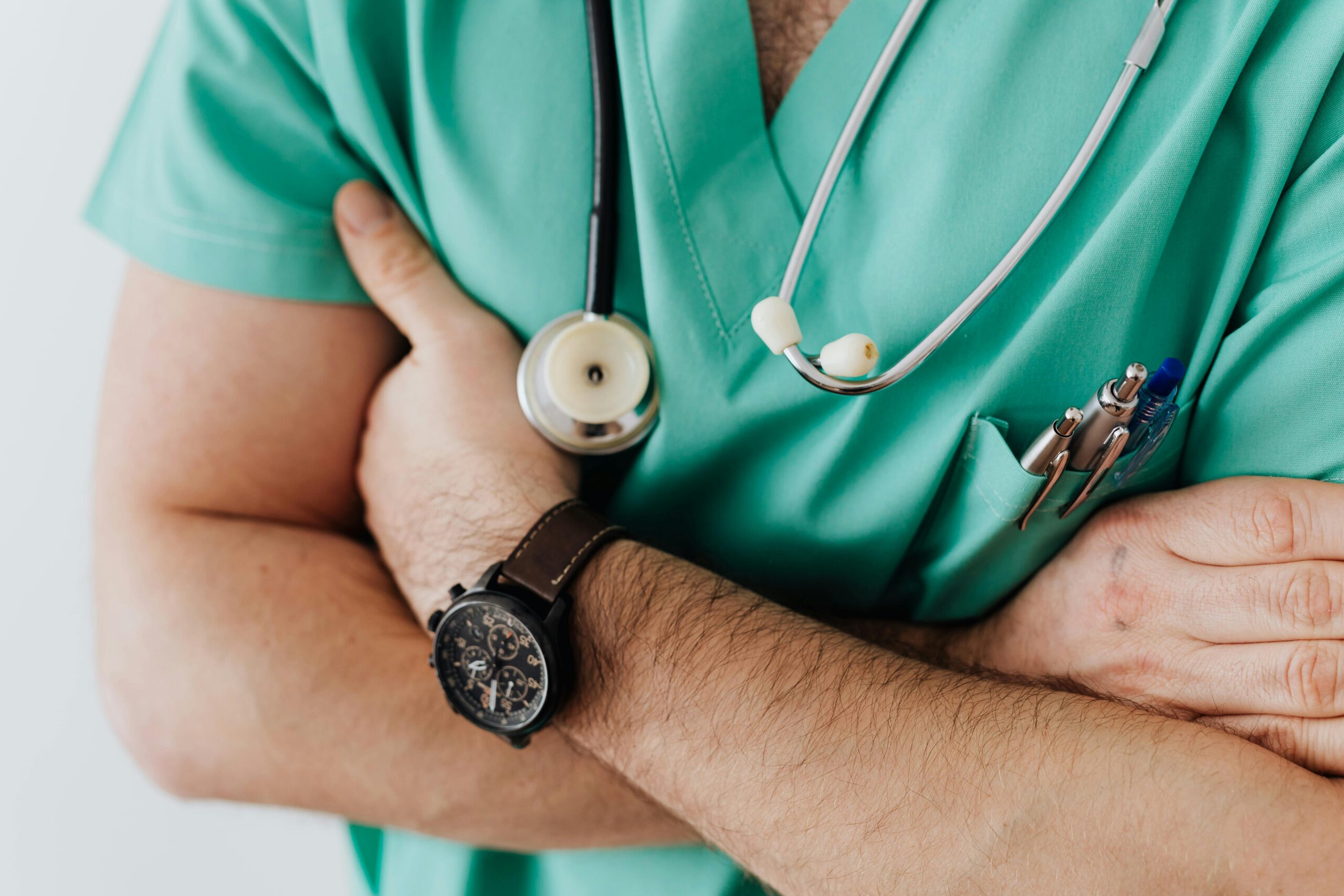 Doctor crossing his arms with stethoscope around neck